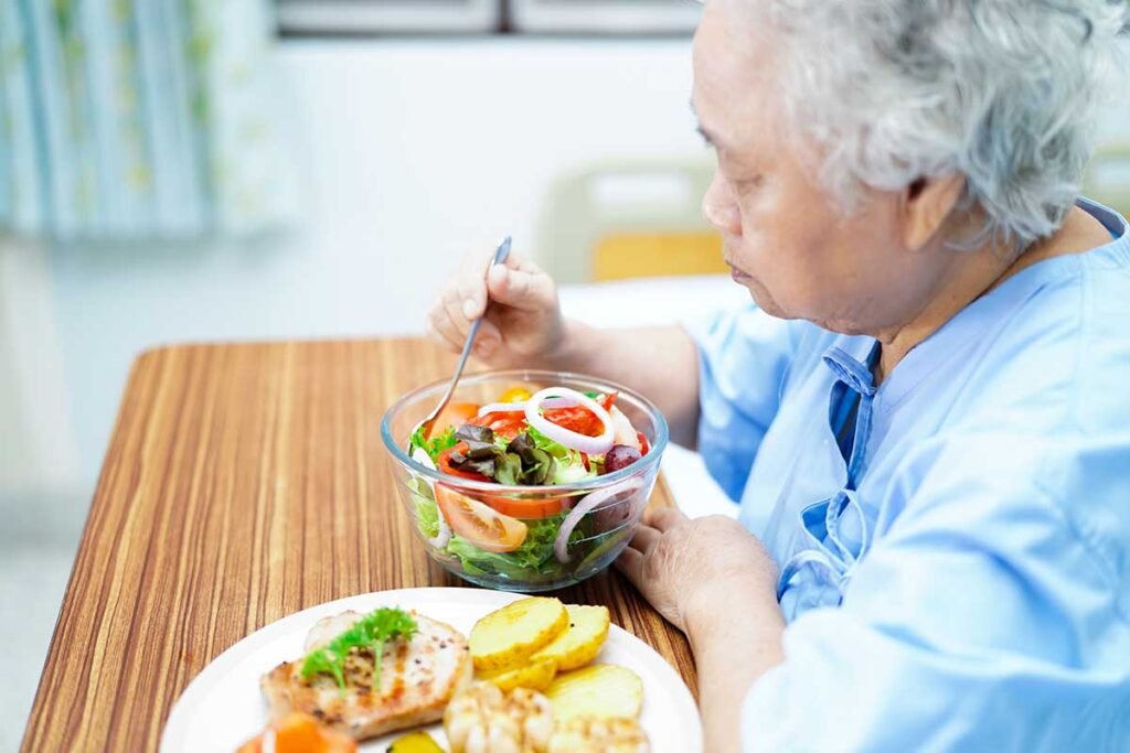 Asian senior or elderly old lady woman patient eating breakfast